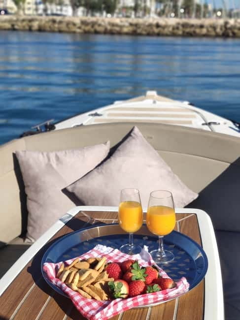 Benalmadena: Boat Rental with No License Required - Cruising the Costa del Sol: photos, swimming, snorkeling, and dolphin hopes