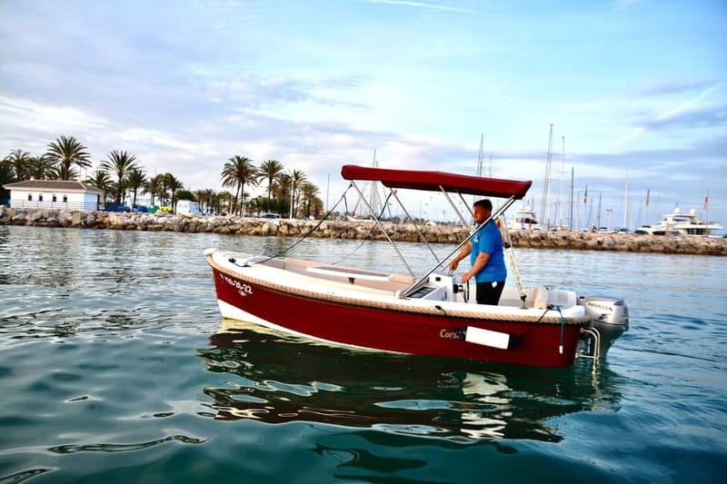 Benalmadena: Boat Rental with No License Required - Deck comforts: solarium, parasol, and a beach fridge