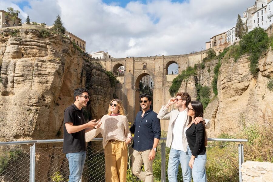 From Málaga: Ronda, White Village & Sevilla Day Trip - Setenil de las Bodegas: Walking Under Stone Roofs