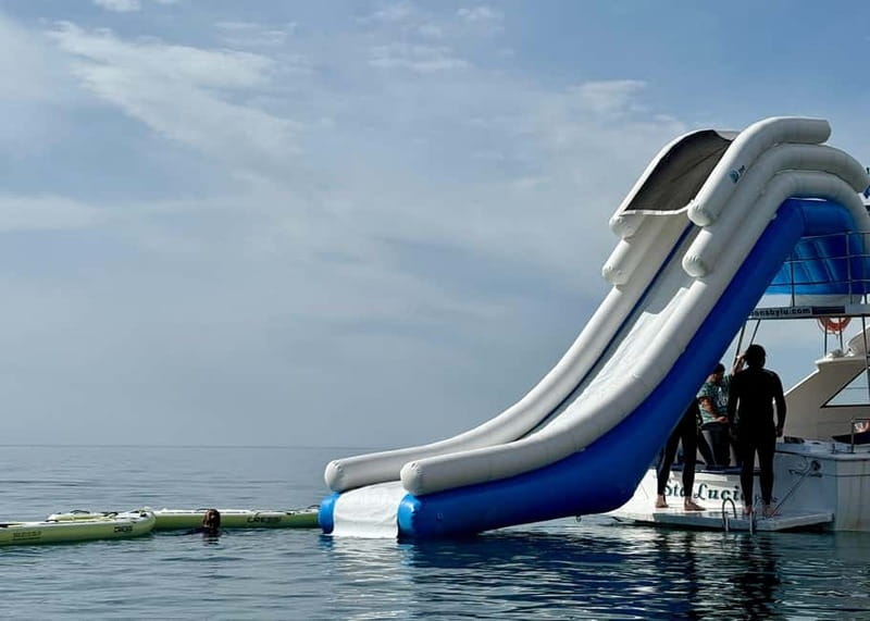 Málaga: Boat Tour w/ Snorkeling, Water Activities, and Lunch - The 20-foot sea slide: the main event for water-lovers