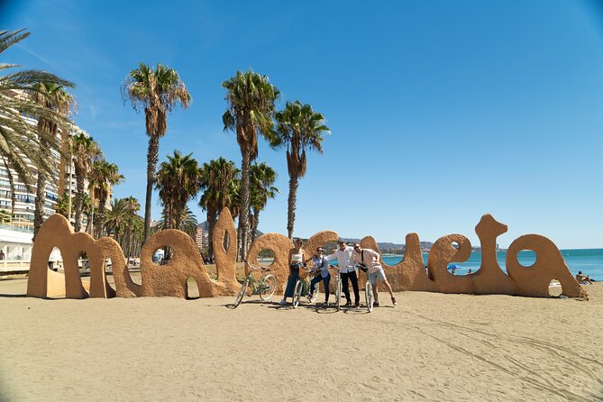Málaga: City Highlights & Hidden Gems Guided Vintage Bike Tour - La Farola Lighthouse: The Story You Remember After the Photo