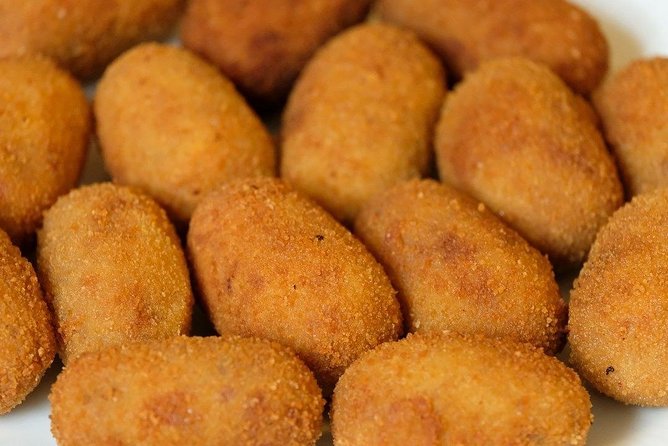 Malaga Market Food Tour: Tapas, Drinks, and Local Flavors - Plaza de la Merced: ancient square, Andalusian plates, and a drink of choice