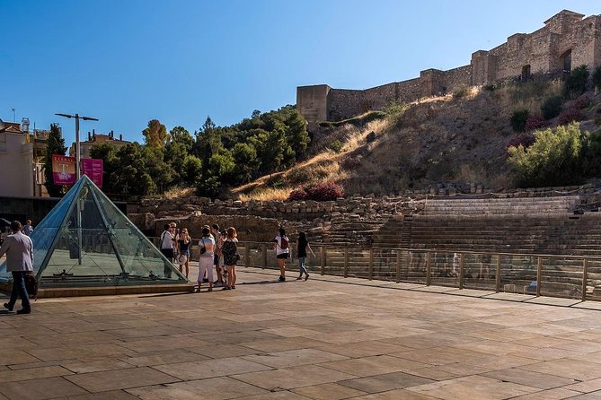 Malaga Tour with Cathedral, Alcazaba and Roman Theatre - Guide style, hearing tips, and why staying near matters