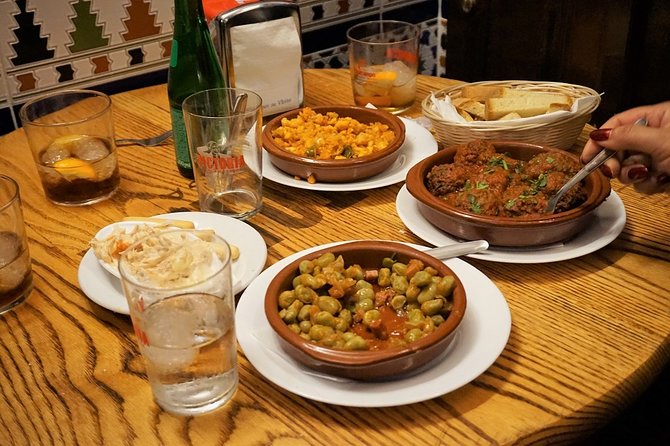 Malaga Traditional Wine & Tapas Tour - Guides, group size, and the social side of the evening