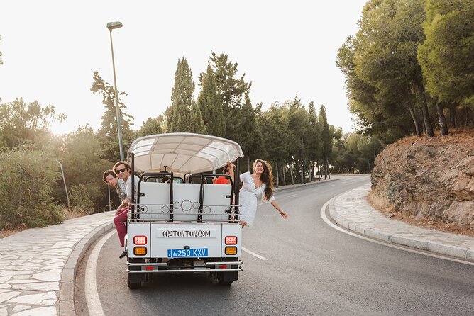 Malaga Welcome Tour with Local Guide in Eco Tuk Tuk Private - La Malagueta Beach: dark sand, easy access, and a real neighborhood feel