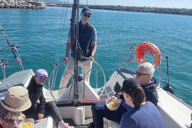 Marbella- sunset from a sailboat with drinks - Weather and safety: when the sea gets rough